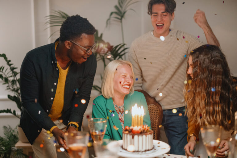 Group of happy friends celebrating birthday. Diverse group of friends having fun at birthday party